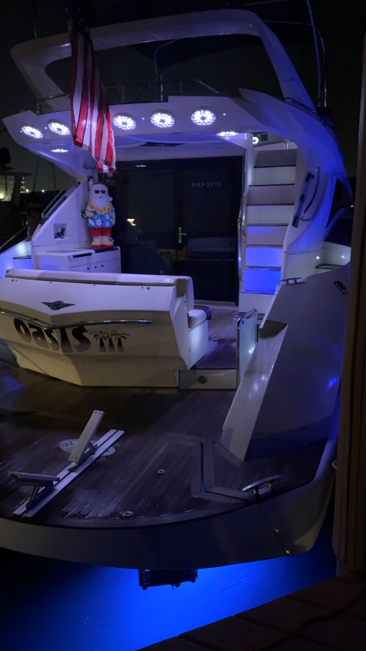 Luxury yacht with LED lights at night for fireworks viewing charter Tampa Bay